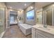 Luxury bathroom featuring a soaking tub, dual vanities, and a spacious walk-in shower at 51 Reflection Cove Dr, Henderson, NV 89011