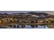 Picturesque lakefront community at dusk surrounded by mountains and illuminated houses at 51 Reflection Cove Dr, Henderson, NV 89011