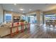 Spacious living room featuring hardwood floors, comfortable seating, and abundant natural light at 51 Reflection Cove Dr, Henderson, NV 89011