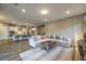 Open-concept living room with a spacious seating area and modern decor at 51 Reflection Cove Dr, Henderson, NV 89011