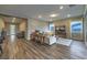 Bright living room with hardwood floors, neutral tones, and comfortable seating arrangement at 51 Reflection Cove Dr, Henderson, NV 89011