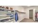 Spacious walk-in closet with ample shelving and storage space for shoes, clothes, and accessories at 51 Reflection Cove Dr, Henderson, NV 89011