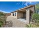 Backyard features a covered patio perfect for outdoor relaxation and entertaining at 5505 Criollo Dr, Las Vegas, NV 89122