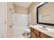Cozy bathroom has a shower and tub combination and vanity with mirror at 5505 Criollo Dr, Las Vegas, NV 89122