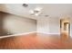 Large bedroom with hardwood flooring, neutral paint, and a ceiling fan at 5505 Criollo Dr, Las Vegas, NV 89122