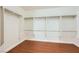 Walk-in closet with wood floors, shelving, and plenty of space for storage at 5505 Criollo Dr, Las Vegas, NV 89122