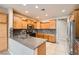 Modern kitchen boasting stainless steel appliances, wooden cabinets, and stylish tile backsplash at 5505 Criollo Dr, Las Vegas, NV 89122
