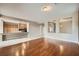 Open-concept living space with hardwood floors flowing into the adjoining kitchen at 5505 Criollo Dr, Las Vegas, NV 89122