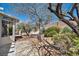 Spacious backyard with desert landscaping and mature trees at 570 Cypress Gardens Pl, Henderson, NV 89012