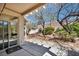 Shady backyard with mature trees and partial cover of patio at 570 Cypress Gardens Pl, Henderson, NV 89012