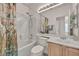 Bathroom features a shower over tub, vanity with mirror, and decorative floral curtain at 570 Cypress Gardens Pl, Henderson, NV 89012