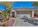 Beautiful single-story home with a well-kept yard and charming desert landscaping at 570 Cypress Gardens Pl, Henderson, NV 89012