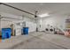 Open garage with concrete floor, washer and dryer, storage cabinets, and utility sink at 570 Cypress Gardens Pl, Henderson, NV 89012