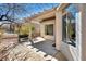 Cozy patio with textured concrete, a partial pergola, and mature landscaping at 570 Cypress Gardens Pl, Henderson, NV 89012