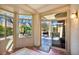 Bright sun room with multiple windows and access to the backyard patio at 570 Cypress Gardens Pl, Henderson, NV 89012
