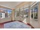 Bright sunroom with multiple windows offering plenty of natural light and outdoor views at 570 Cypress Gardens Pl, Henderson, NV 89012