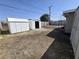 Spacious backyard featuring sheds, minimal landscaping, and perimeter fencing at 620 N 16Th St, Las Vegas, NV 89101
