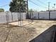 Backyard featuring a gazebo structure on a dirt lot with a white lattice fence at 620 N 16Th St, Las Vegas, NV 89101