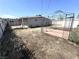 View of backyard with a gazebo, dirt lot, and perimeter fencing at 620 N 16Th St, Las Vegas, NV 89101