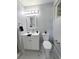 Well-lit bathroom featuring a modern vanity, toilet, and a decorative plant at 620 N 16Th St, Las Vegas, NV 89101