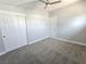 Cozy bedroom with plush carpeting, standard closet, and modern ceiling fan for a comfortable space at 620 N 16Th St, Las Vegas, NV 89101