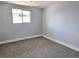 Cozy bedroom with plush carpeting, a window and modern gray color scheme at 620 N 16Th St, Las Vegas, NV 89101