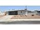 Charming single-story home with a desert-landscaped front yard and a covered parking area at 620 N 16Th St, Las Vegas, NV 89101