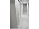 Hallway showcasing contemporary marble flooring, white trim, and sliding closet doors for a clean aesthetic at 620 N 16Th St, Las Vegas, NV 89101