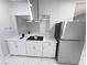 Bright kitchen with stainless steel appliances, white cabinets, and modern range hood at 620 N 16Th St, Las Vegas, NV 89101