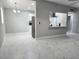Spacious living room with marble tile and open access to the modern kitchen at 620 N 16Th St, Las Vegas, NV 89101