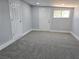 Neutral room boasts plush carpeting, clean white trim, recessed lighting and two white doors for privacy at 620 N 16Th St, Las Vegas, NV 89101