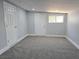 Neutral room boasts plush carpeting, clean white trim, recessed lighting and two white doors for privacy at 620 N 16Th St, Las Vegas, NV 89101