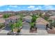 A high-angle view showcases the beautiful home nestled in a well-maintained neighborhood with mountain views at 6217 Lone Cypress Ct, Las Vegas, NV 89141
