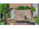 Aerial view of the backyard, featuring artificial turf, a covered patio with an outdoor seating area at 6217 Lone Cypress Ct, Las Vegas, NV 89141