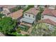 Aerial view of the home's backyard highlighting a pergola, covered seating area, manicured landscaping and hardscape at 6217 Lone Cypress Ct, Las Vegas, NV 89141