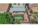 Bird's eye view of outdoor area, with artificial turf, covered patio, lounge furniture, brick features, and a pergola at 6217 Lone Cypress Ct, Las Vegas, NV 89141