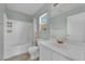 A well-lit bathroom featuring a tub-shower combo, a neutral color palette and modern fixtures at 6217 Lone Cypress Ct, Las Vegas, NV 89141