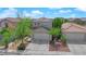 Charming two-story home featuring a well-maintained front yard with mature trees and a two-car garage at 6217 Lone Cypress Ct, Las Vegas, NV 89141