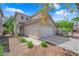 Attractive home showcasing a two-car garage, neat landscaping, and a charming exterior at 6217 Lone Cypress Ct, Las Vegas, NV 89141