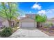 Charming two-story home featuring a two-car garage and well-maintained landscaping in a residential neighborhood at 6217 Lone Cypress Ct, Las Vegas, NV 89141