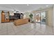 Bright living room features tile floors, lots of natural light, and a seamless transition to the outdoor patio area at 6217 Lone Cypress Ct, Las Vegas, NV 89141