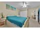Relaxing main bedroom featuring plush bedding and ample natural light at 6217 Lone Cypress Ct, Las Vegas, NV 89141