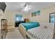 Comfortable bedroom with dual beds, ceiling fan, and neutral walls at 6217 Lone Cypress Ct, Las Vegas, NV 89141