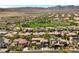 A community view showcases terracotta-roofed houses interspersed with green space, and is set against desert mountain scenery at 631 Coriander Canyon Ct, Las Vegas, NV 89138