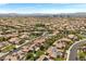 Vast community of homes showcases terracotta roofs, green spaces, and is conveniently located near the city at 631 Coriander Canyon Ct, Las Vegas, NV 89138