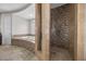 Lavish bathroom featuring soaking tub and stand up shower with detailed tile work at 631 Coriander Canyon Ct, Las Vegas, NV 89138