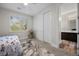 Bright bedroom with a large window, closet, and ensuite bathroom access at 631 Coriander Canyon Ct, Las Vegas, NV 89138