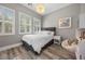 Bright bedroom with a large window, comfortable bed, and stylish decor at 631 Coriander Canyon Ct, Las Vegas, NV 89138