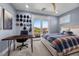 Comfortable bedroom featuring balcony access, hats on the wall, and natural light at 631 Coriander Canyon Ct, Las Vegas, NV 89138