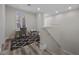 Bright bonus room with a cozy rug, desk, and staircase access at 631 Coriander Canyon Ct, Las Vegas, NV 89138